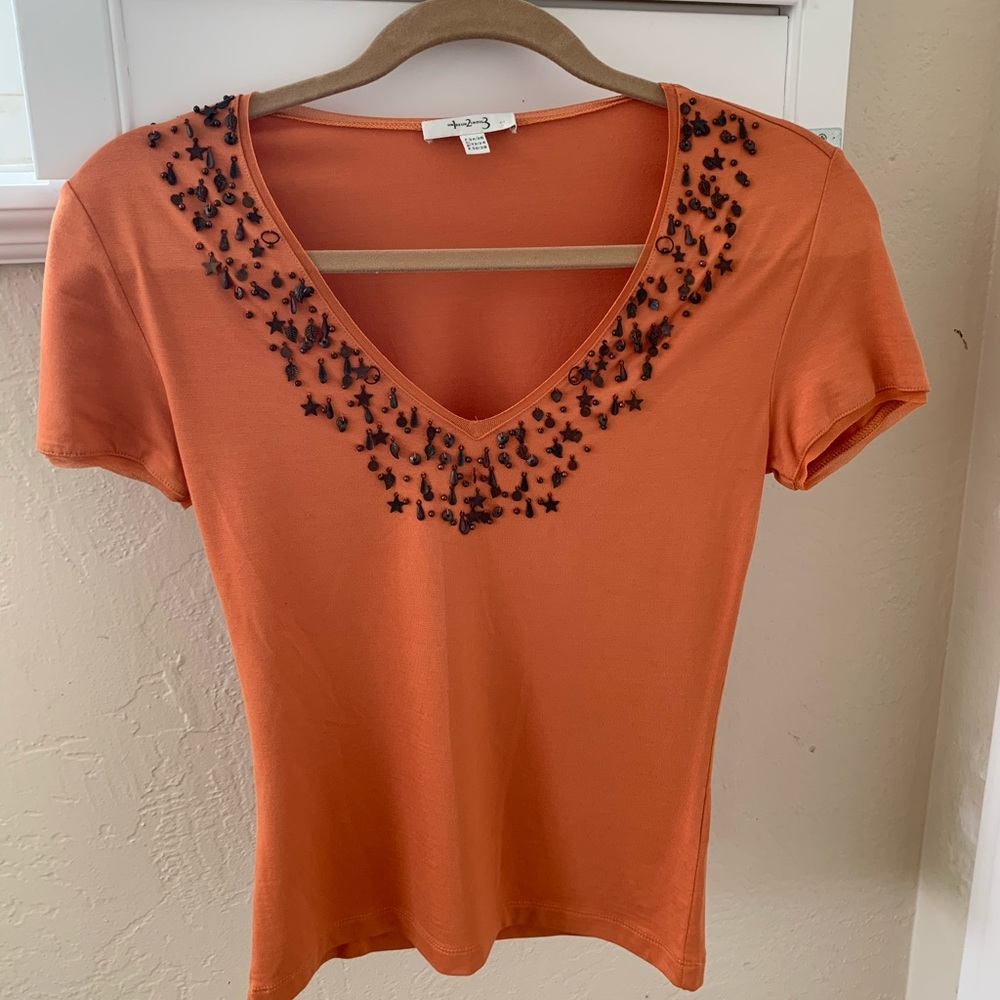 Orange top with short sleeves